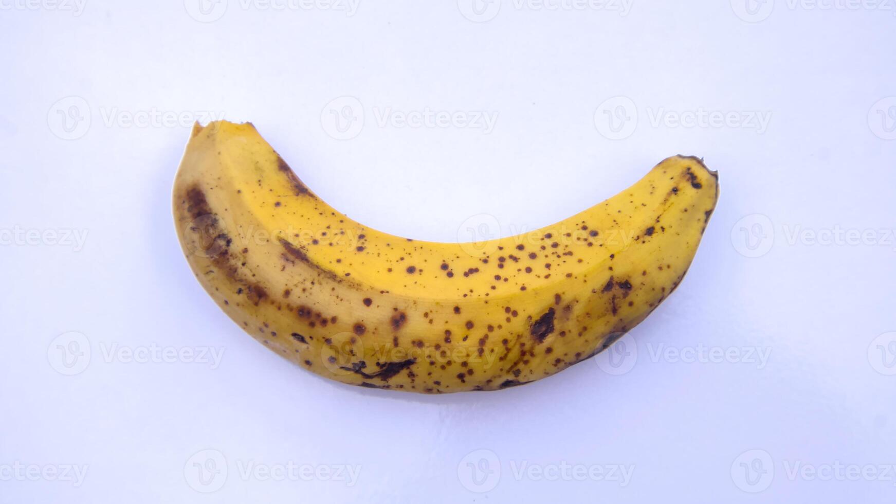 Ripe Spotted Banana Top View Close-Up Isolated on White Background photo