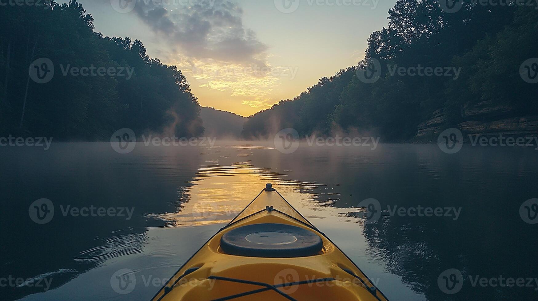 A kayak is in the water at sunset photo