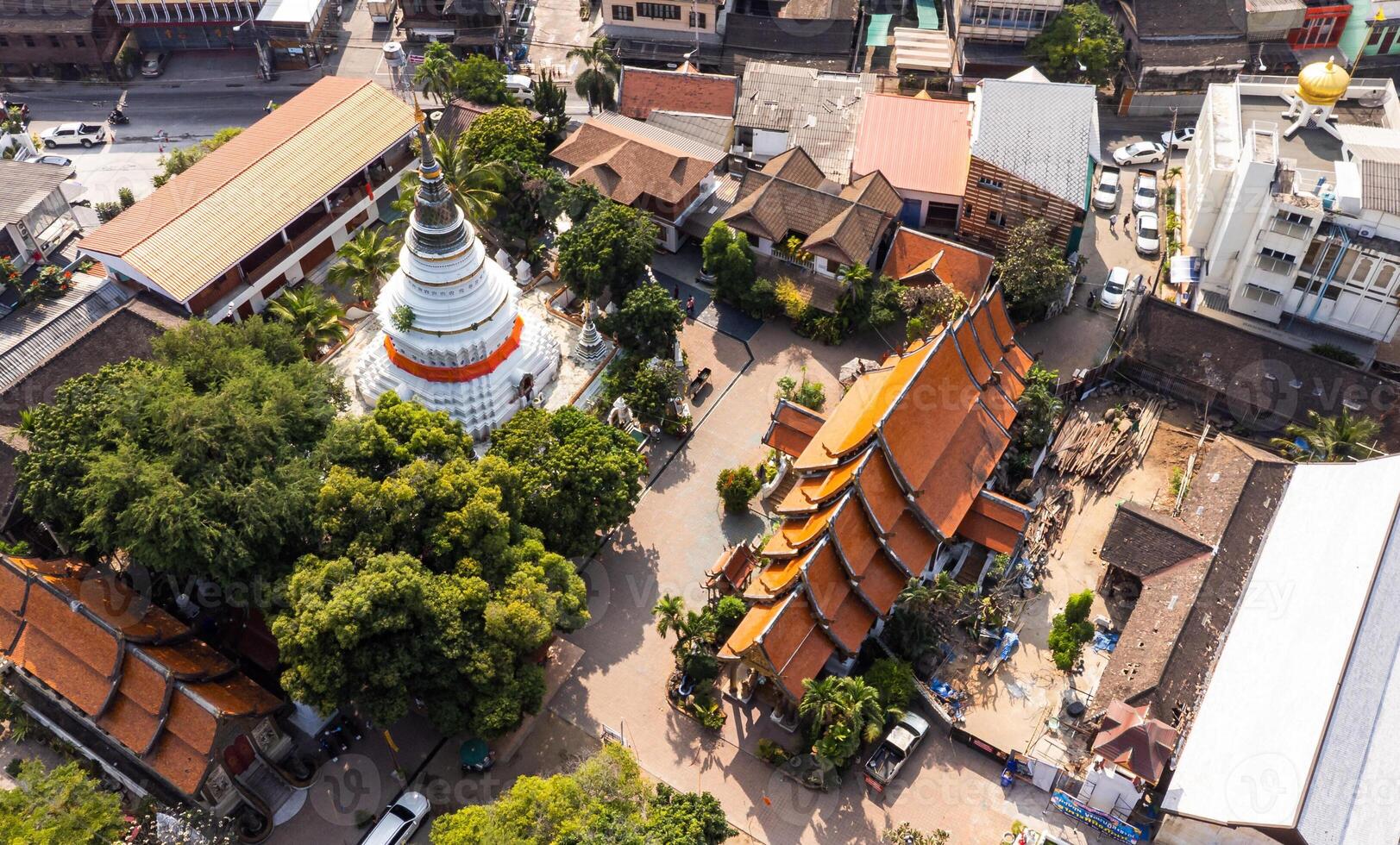Aerial view of Wat Ket Karam Temple in Chiang Mai, Thailand, showcasing traditional architecture and lush greenery photo