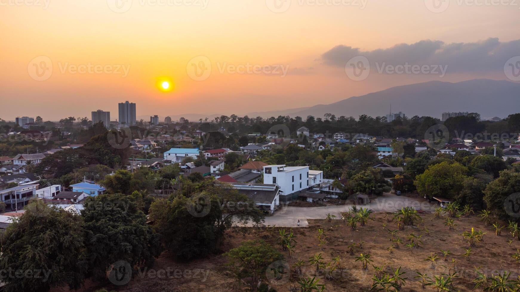 Sunset illuminating Chiang Mai City and Doi Suthep Mountain with dirty air photo