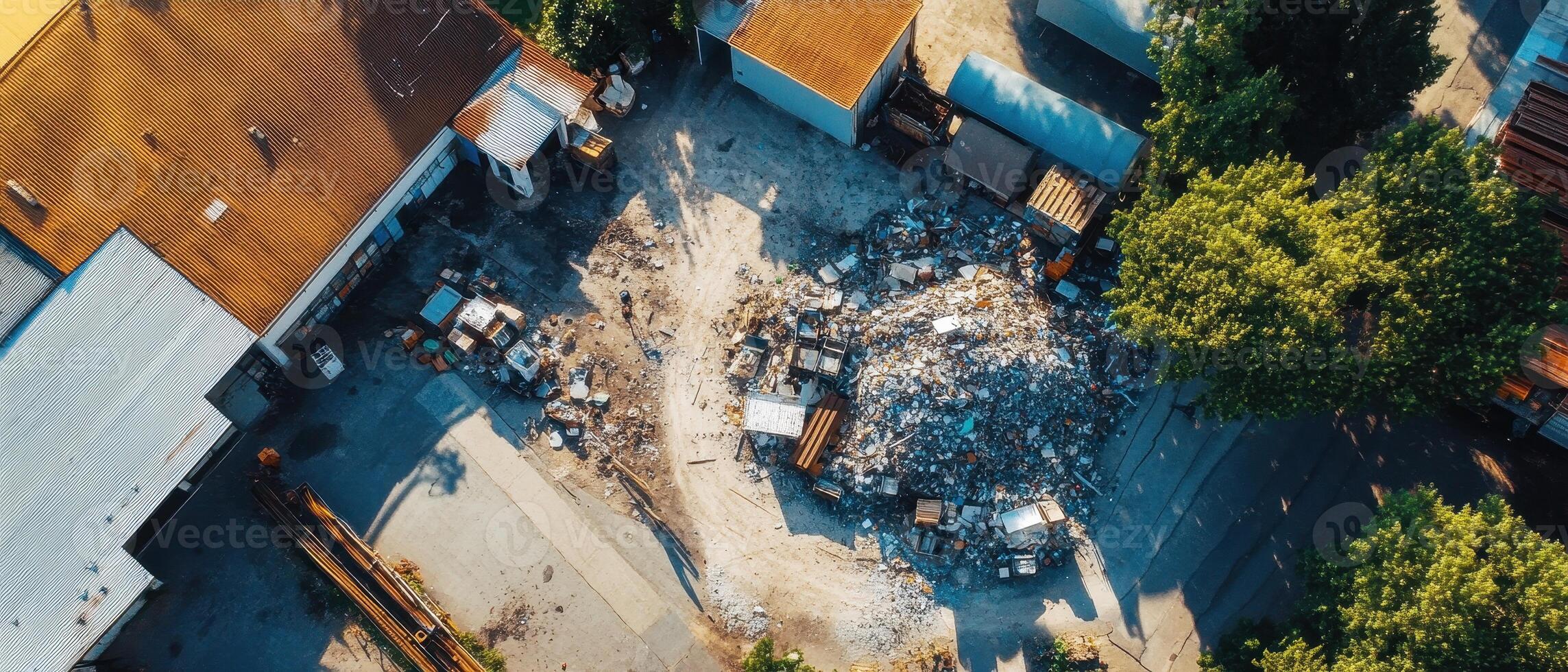 ESG Investing Trends Concept. Aerial view of a construction site with debris, machinery, and surrounding foliage, showcasing industrial activity and land use. photo