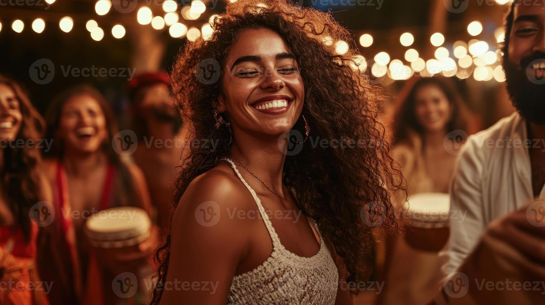 A joyful celebration under string lights, featuring a smiling woman amidst friends, creating a vibrant atmosphere with music and dance. photo