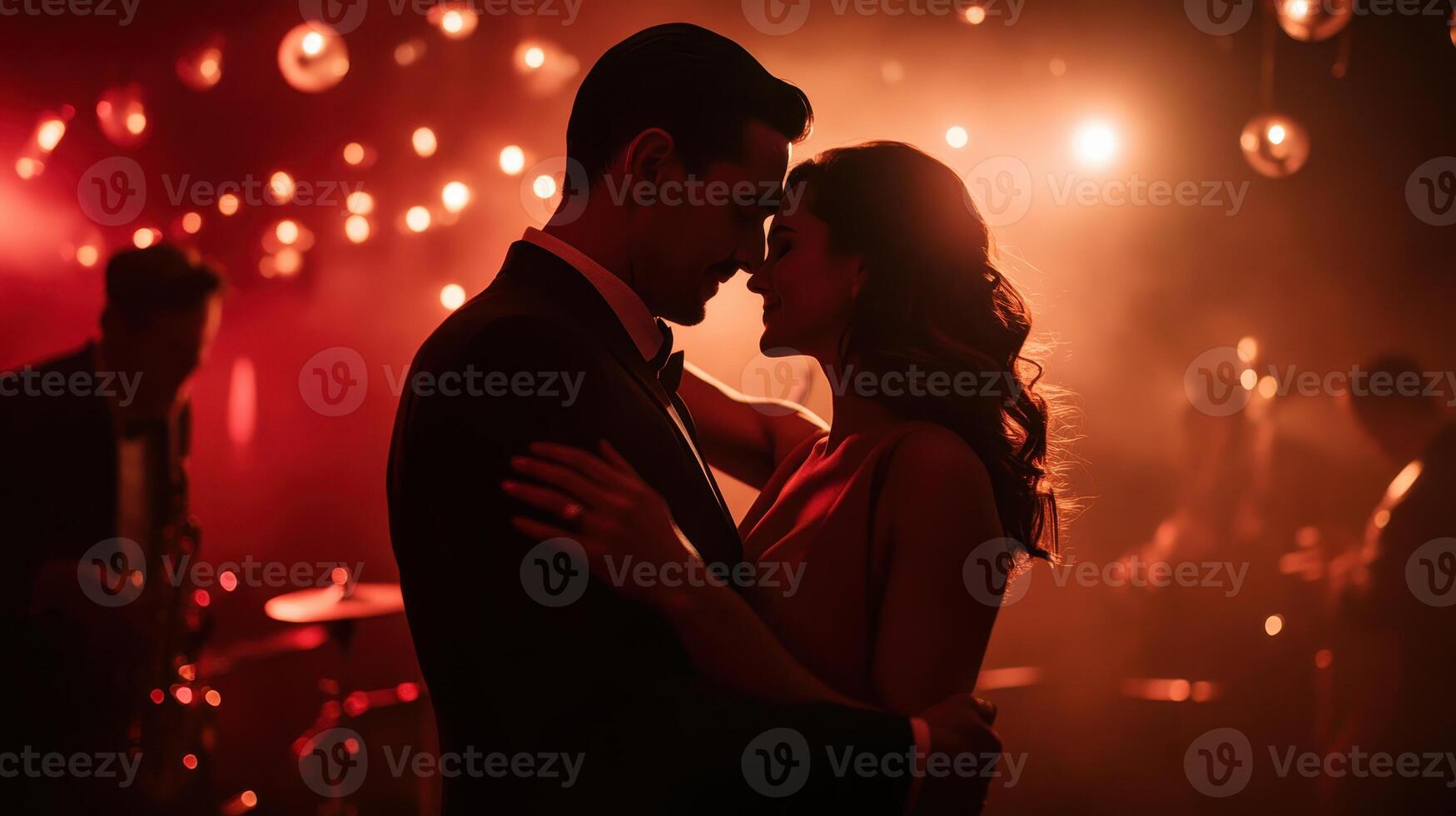 A couple shares an intimate dance under soft, romantic lights, creating a warm, enchanting atmosphere filled with love and connection. photo