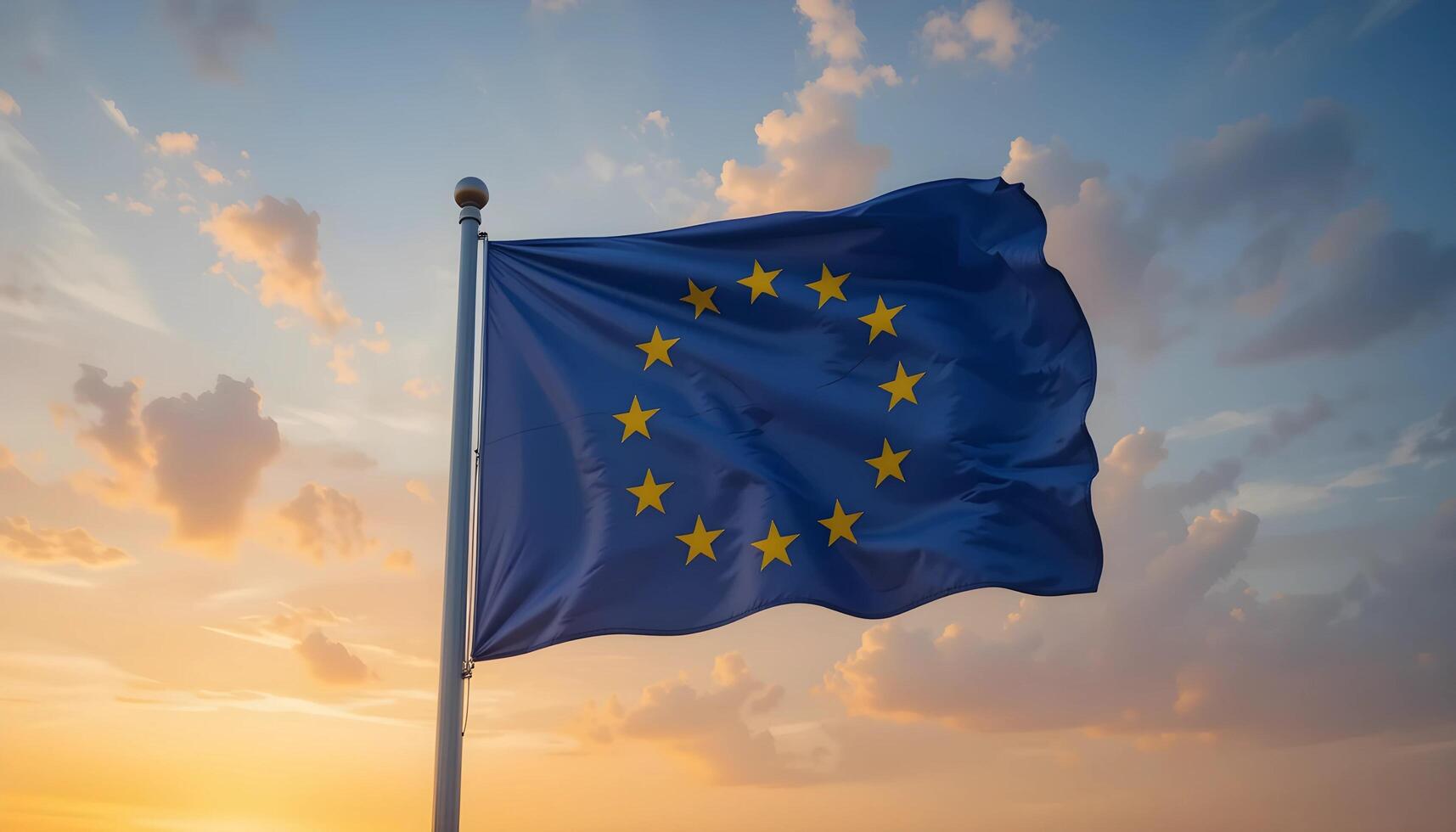 European Union flag flapping against a sunset sky photo