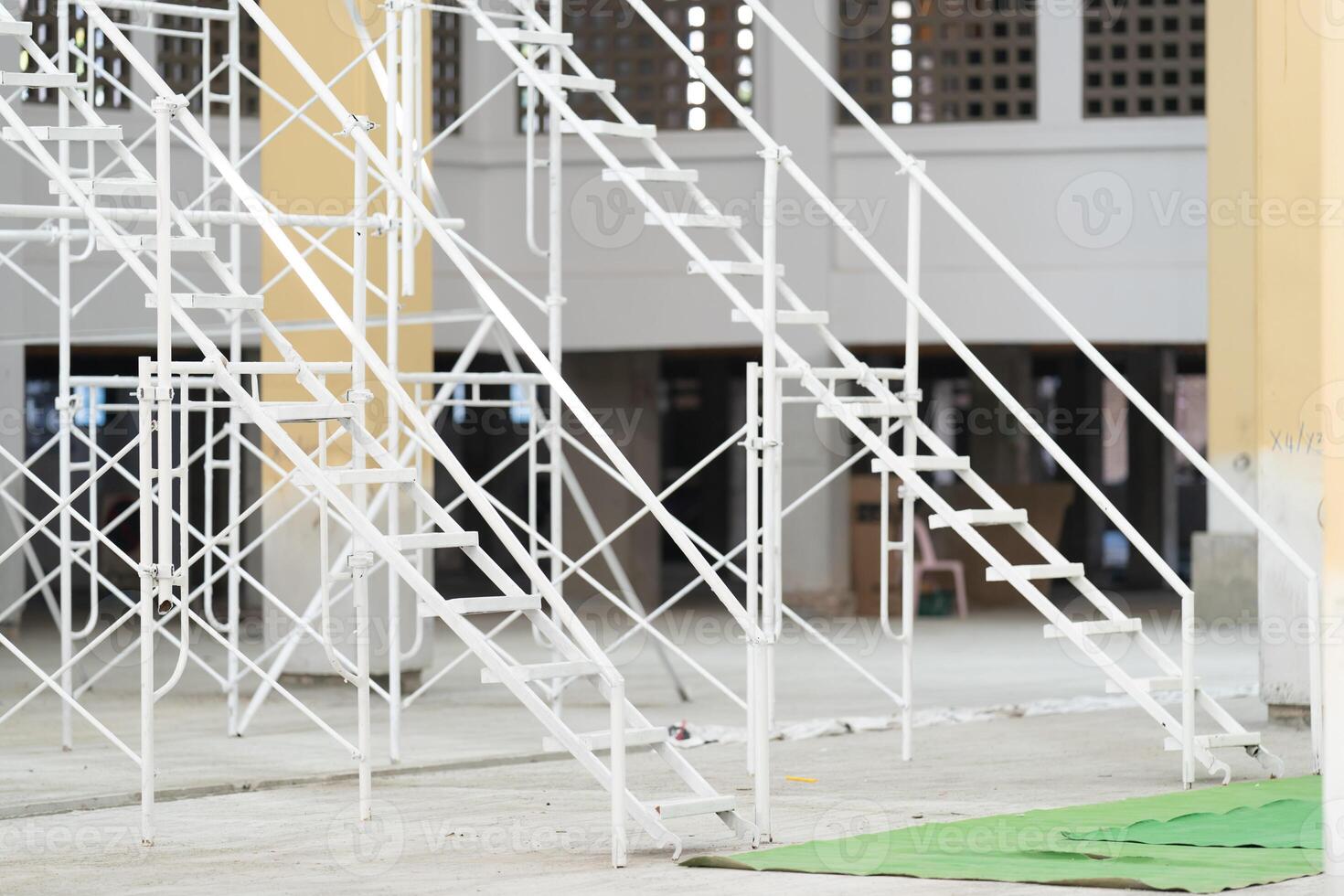 The steel used to construct the white scaffolding ladder is sturdy and long lasting. photo