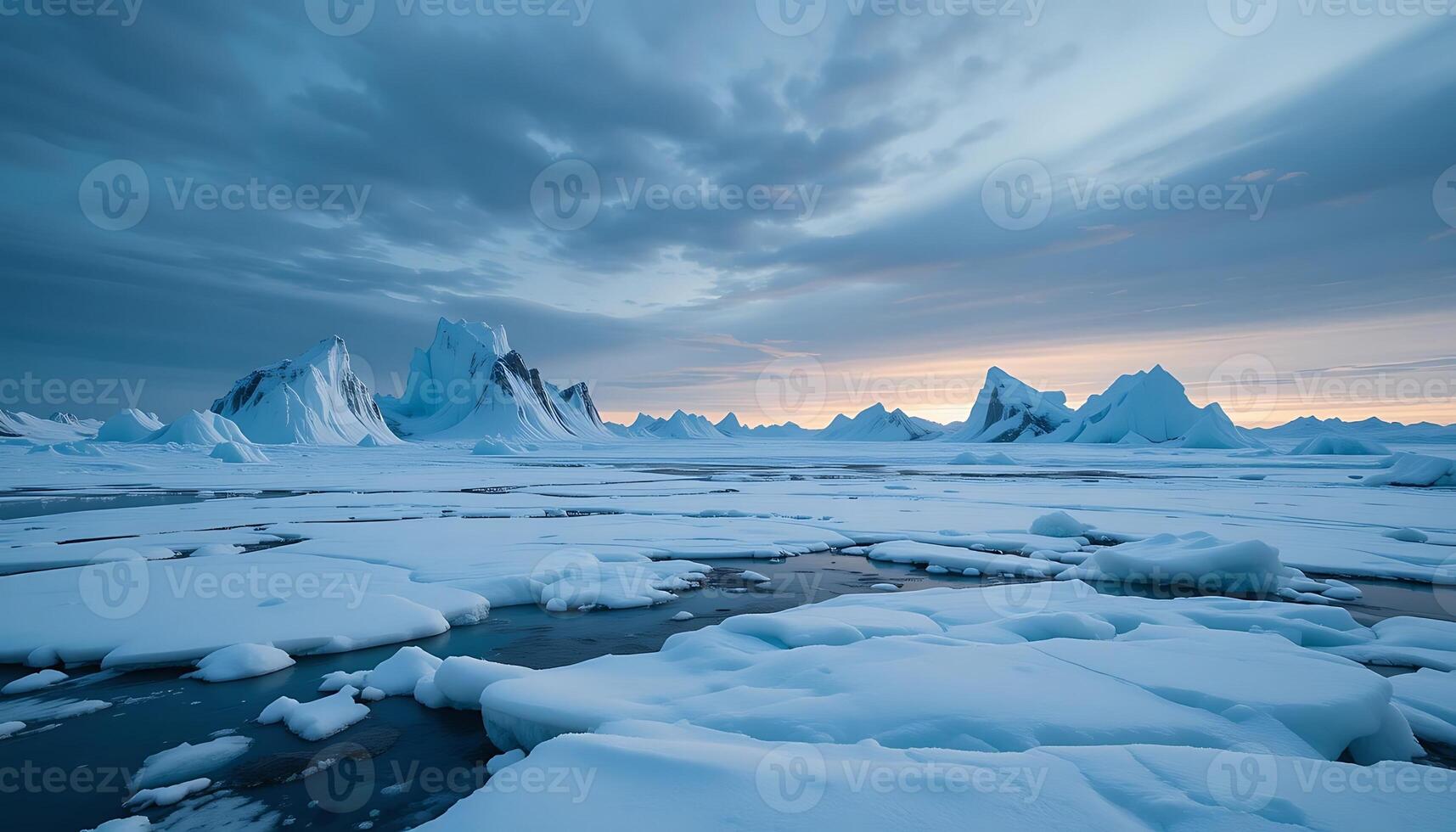 Icebergs and Frozen Landscape Scenery Under a Cloudy Sky at Dusk photo