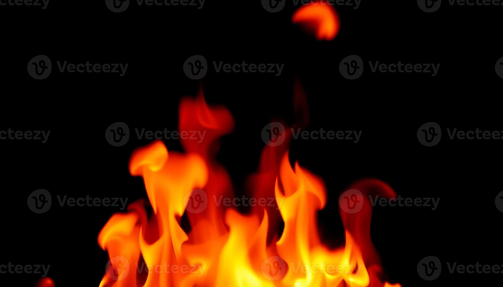 Dynamic and Engaging Flames Dancing Against a Dark Background photo