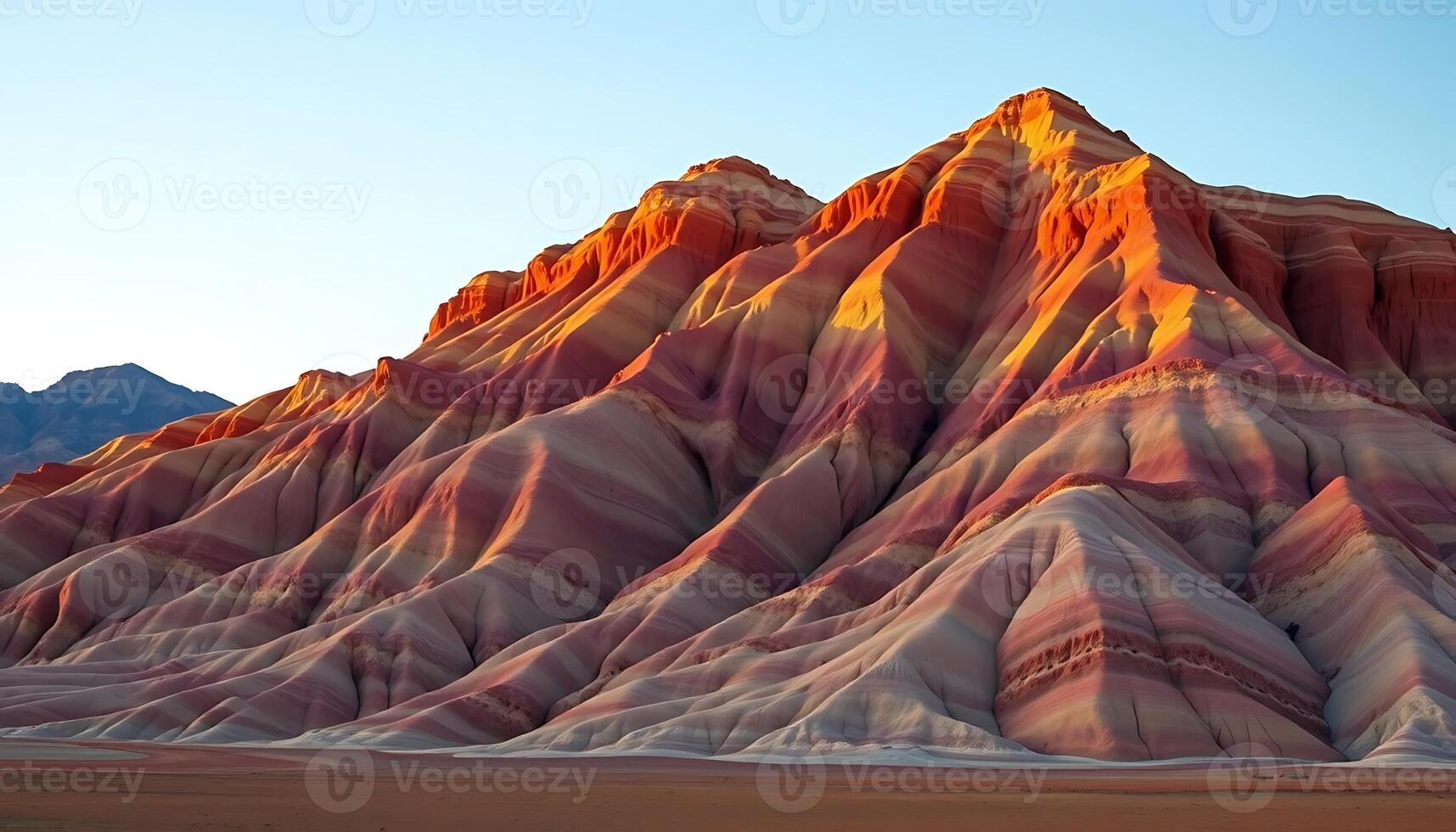 Stunning Geological Formation Displaying Colorful Striations Under Clear Sky photo