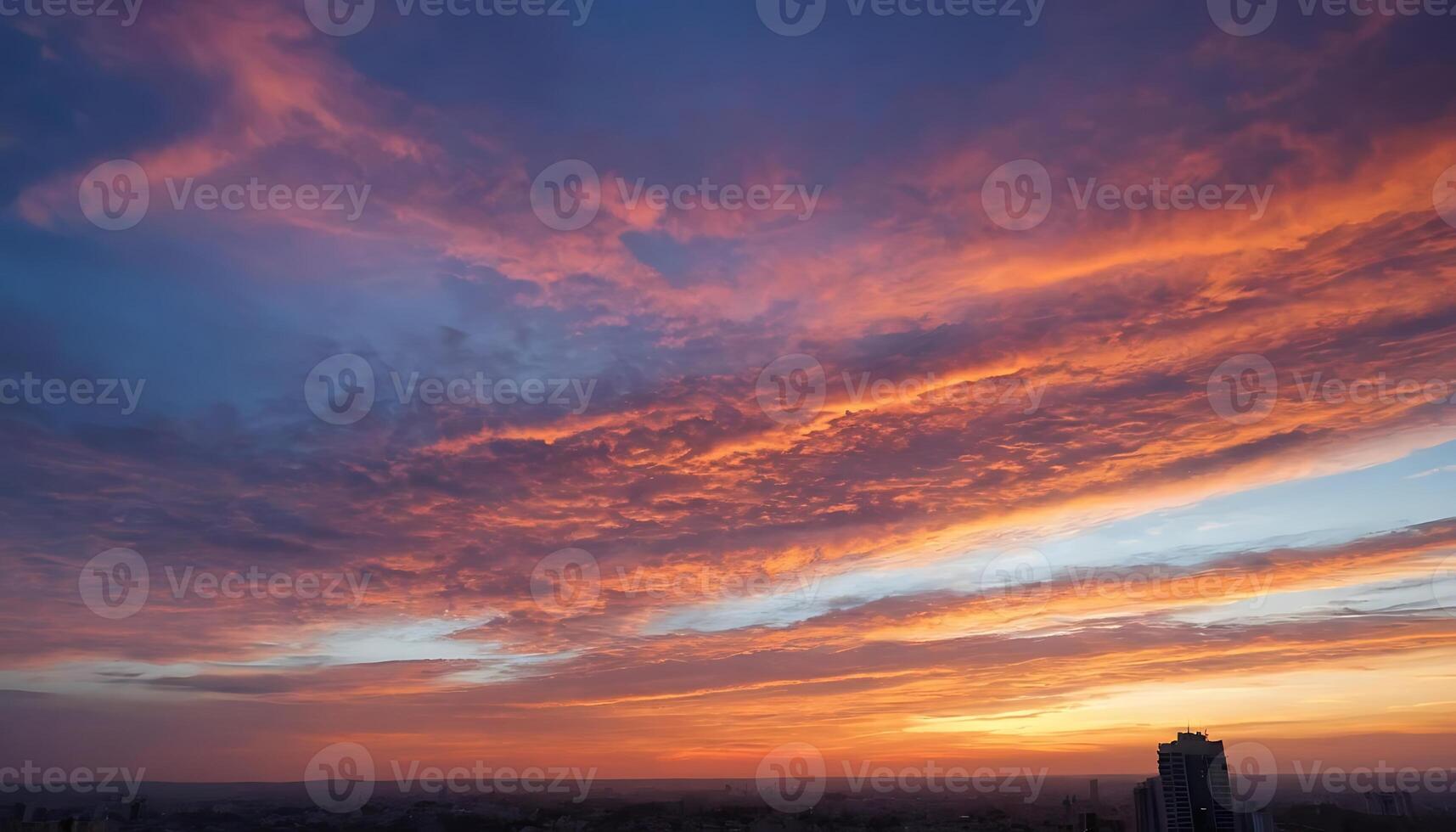 Stunning Sunset with Colorful Sky and Cloud Patterns Over Urban Skyline photo