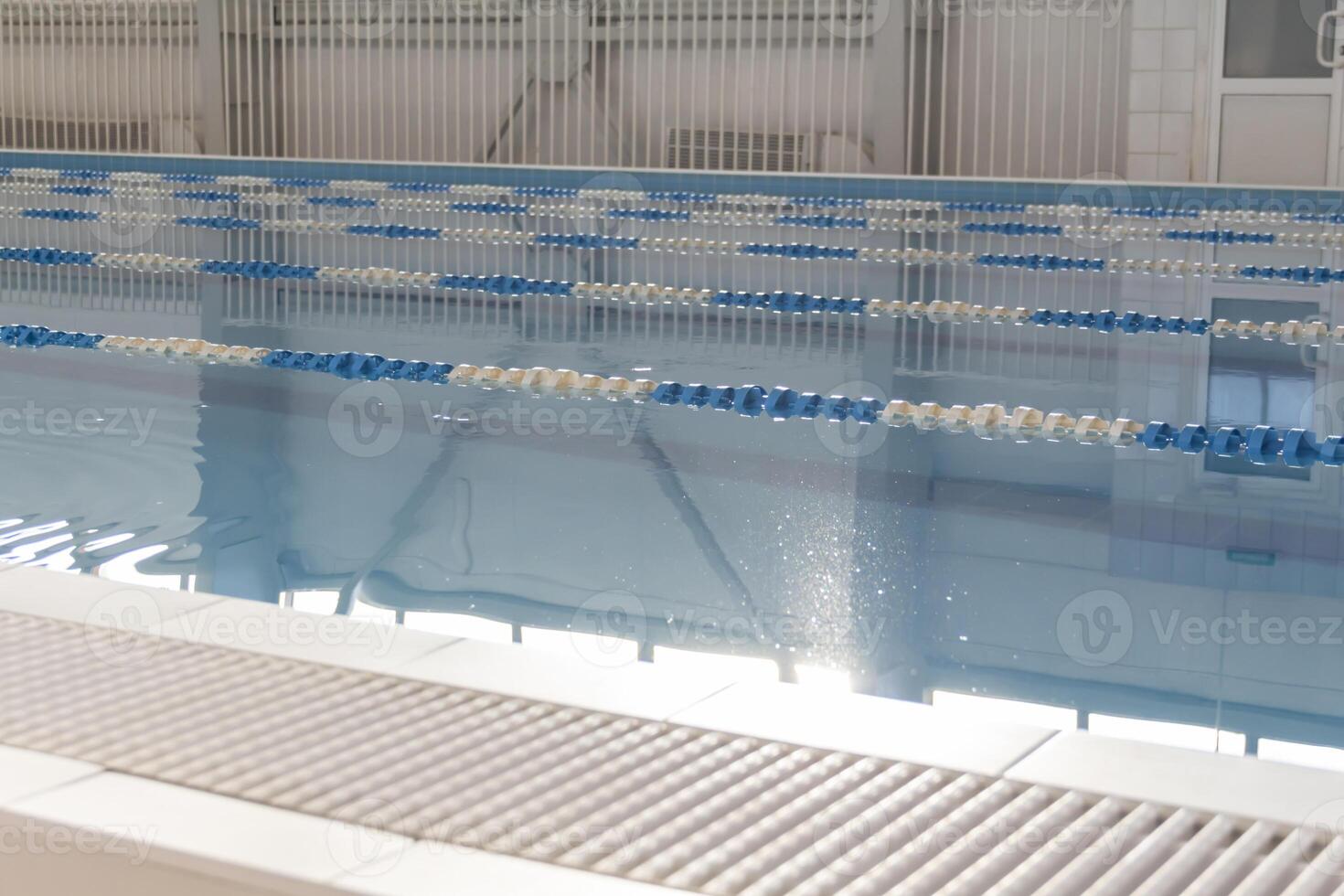 A large swimming pool with clear blue water in the hotel or relaxation and relaxation. photo