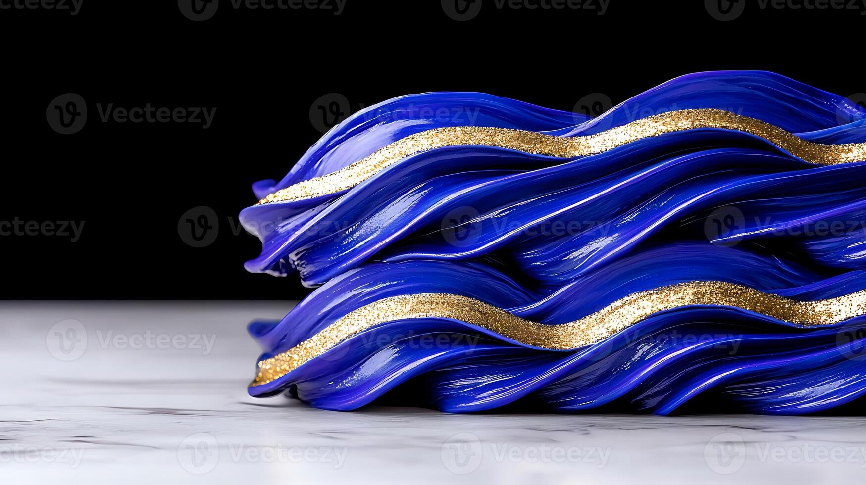 Close-up of vibrant blue decorative waves with golden accents on a marble surface against a black backdrop photo