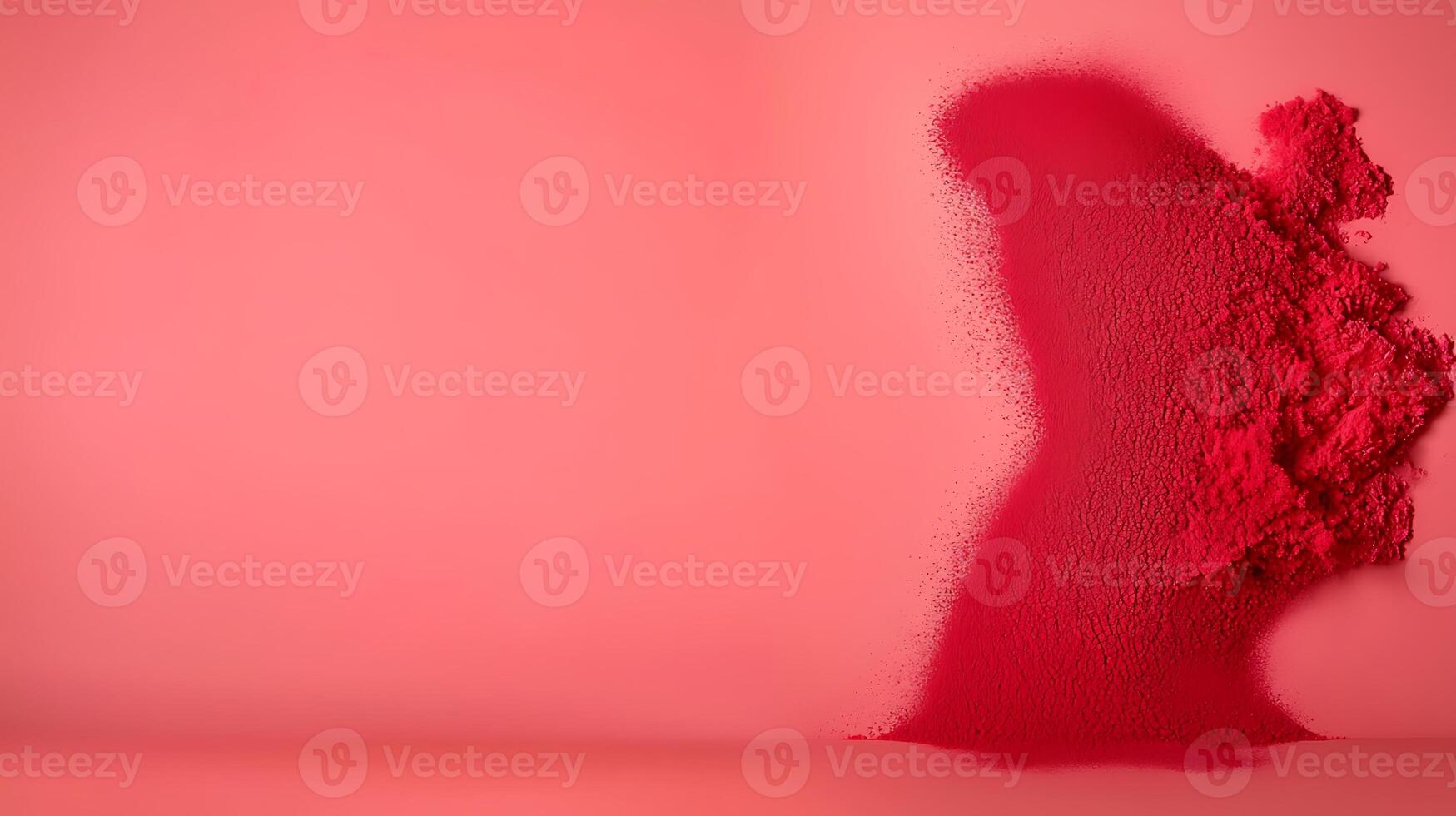 Vibrant pink powder cascading against a smooth pink backdrop, creating an artistic abstract effect photo