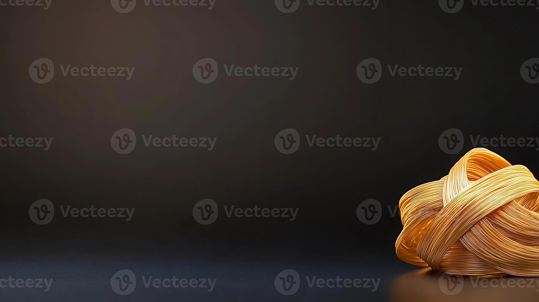 A close-up of a beautifully arranged knot of pasta on a dark background, emphasizing texture photo