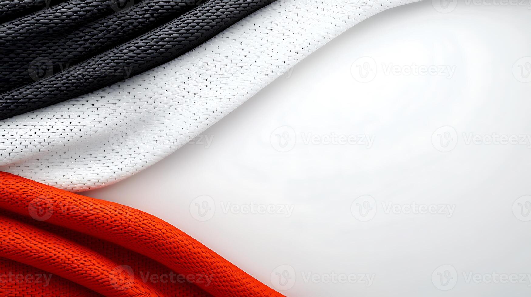 Abstract composition of flowing fabric in black, white, and red with a smooth background photo