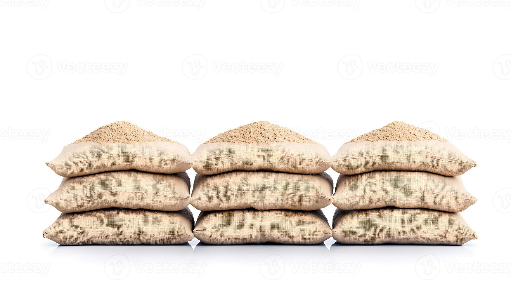 Stacked burlap sacks filled with grains on a clean white background, showcasing agricultural produce photo