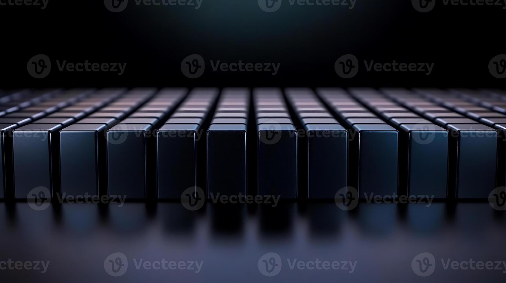 Close-up view of a series of glossy black blocks arranged in a grid pattern on a dark surface photo
