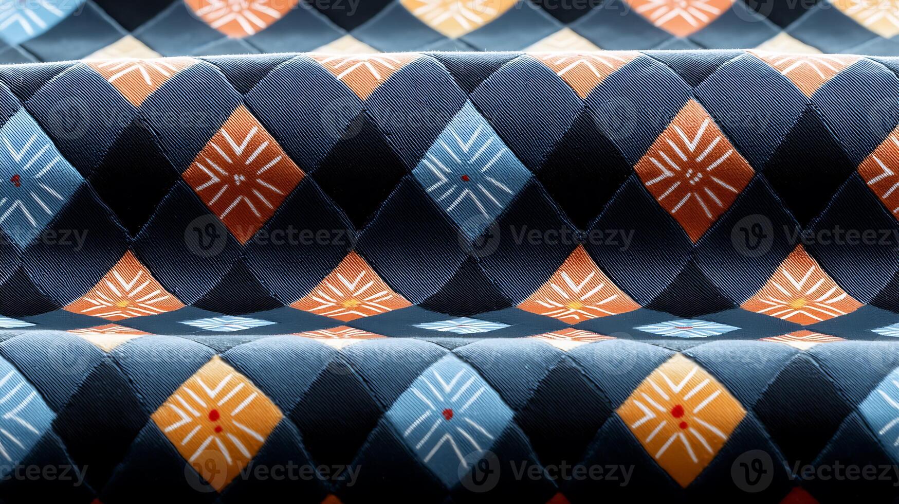 Close-up view of a patterned fabric showcasing vibrant geometric designs in rich colors photo