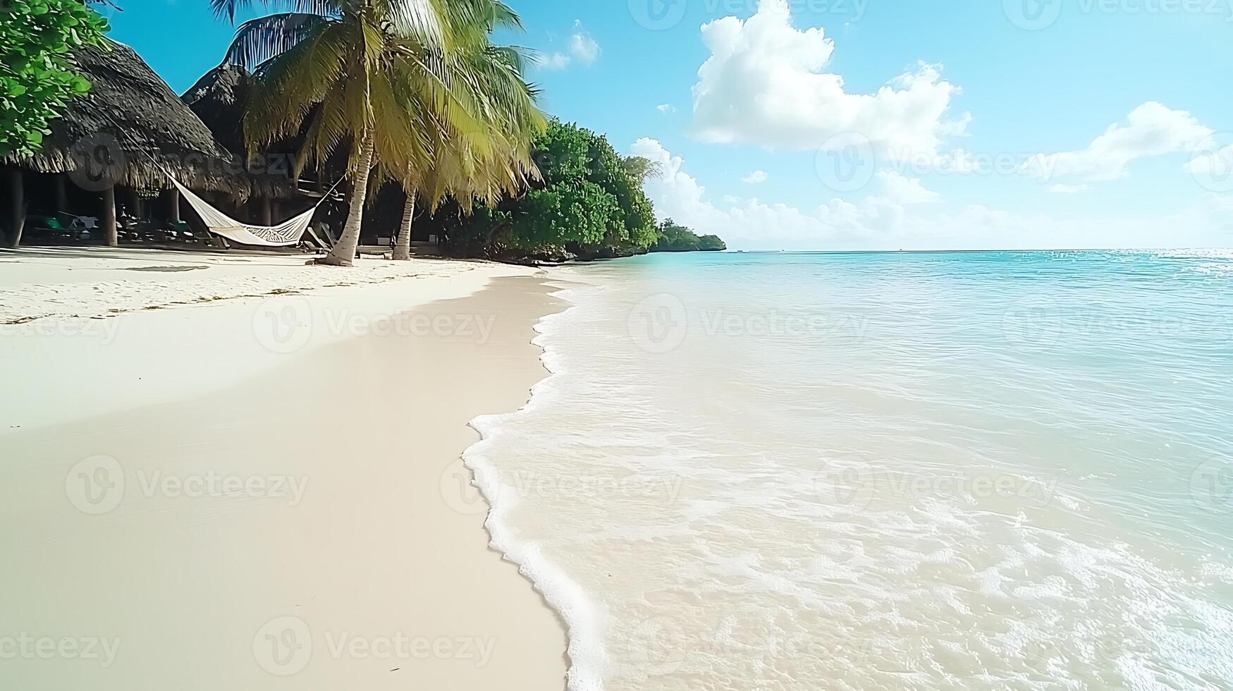 Serene beach scene with gentle waves lapping at the shore under a bright blue photo