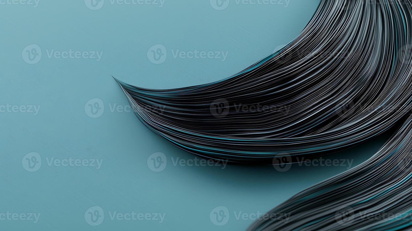 Close-up of flowing black hair strands with turquoise highlights on a smooth teal background photo