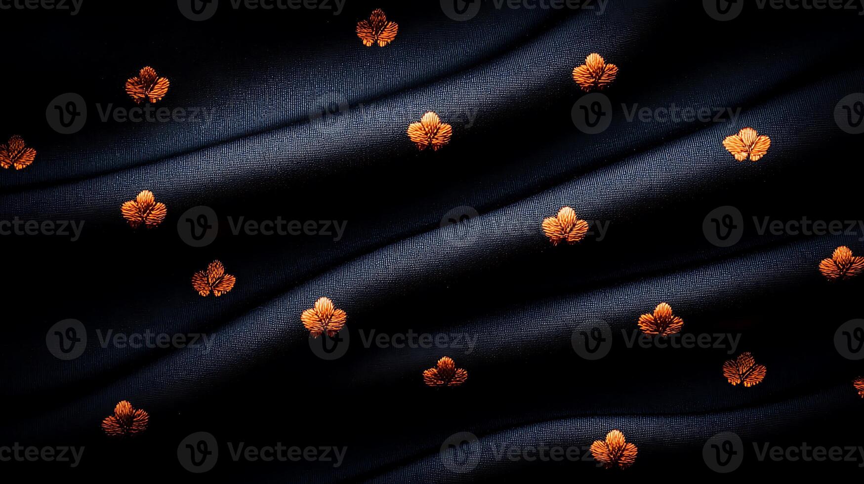 Elegant dark fabric with golden floral patterns, showcasing smooth draping and rich texture photo