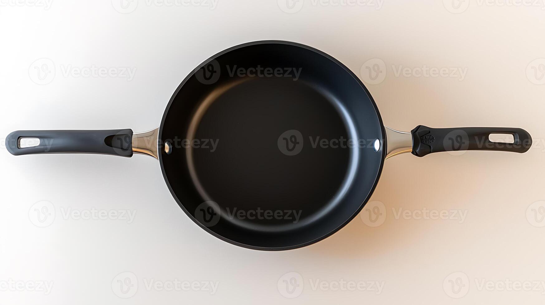 A sleek, modern frying pan with a non-stick surface, positioned on a light background, ideal for cooking photo