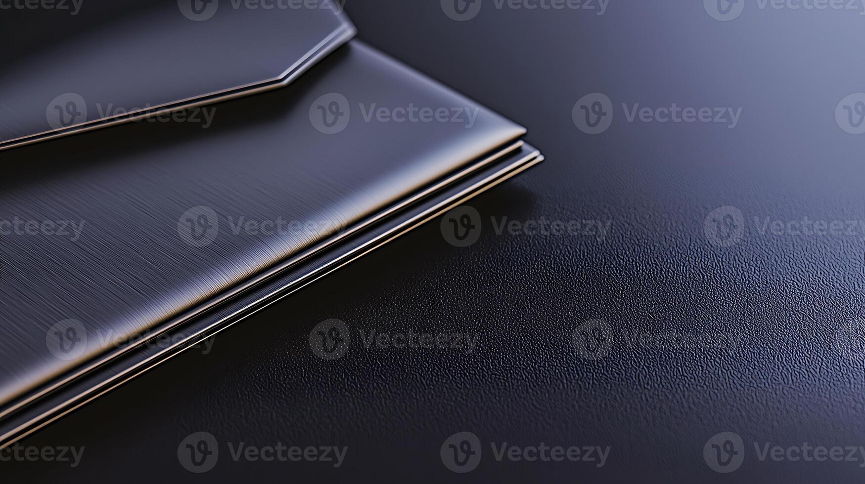 A close-up view of sleek black envelopes resting on a textured dark surface, showcasing elegance photo