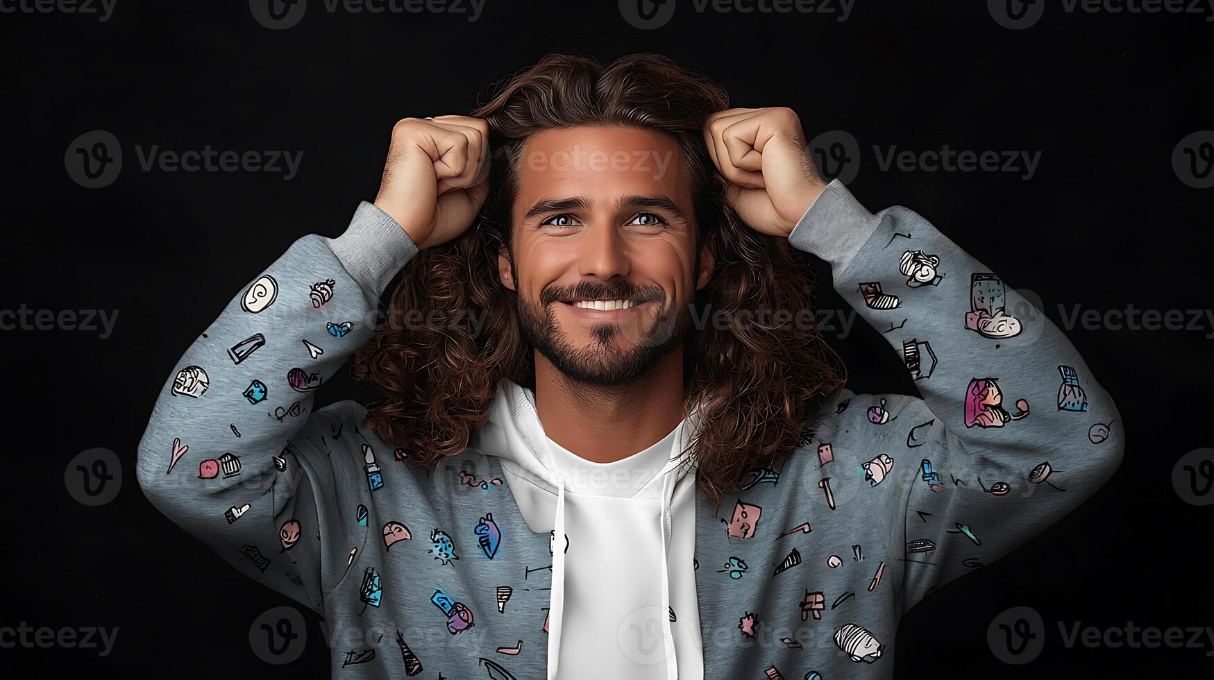 Smiling man with long curly hair celebrates with raised fists against a dark background photo