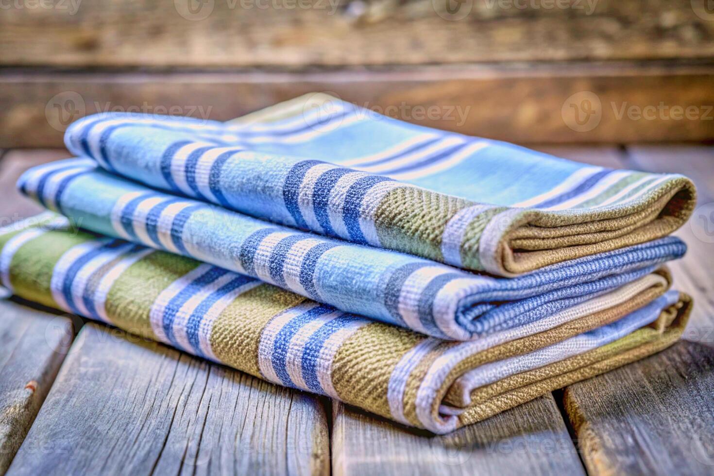 Neatly folded stacks of kitchen buth towels, fabrics, tablecloths, curtains photo