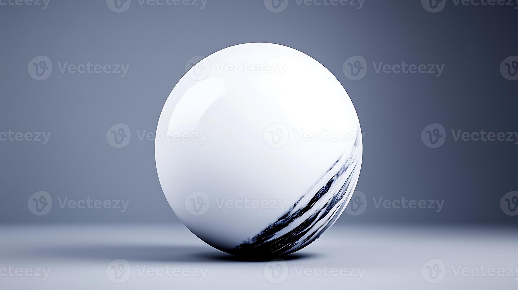 A glossy white marble sphere with black streaks, placed on a smooth gray surface, showcasing elegance photo