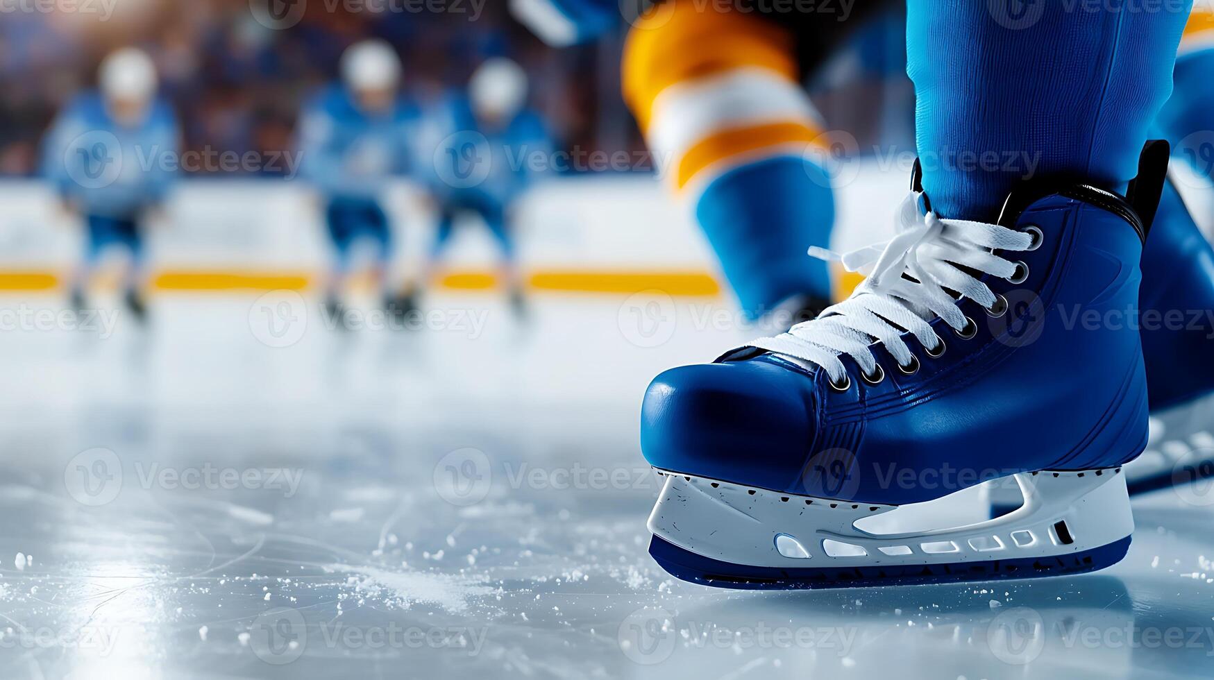 Close-up of an ice hockey player's skate on the rink with teammates in action behind photo