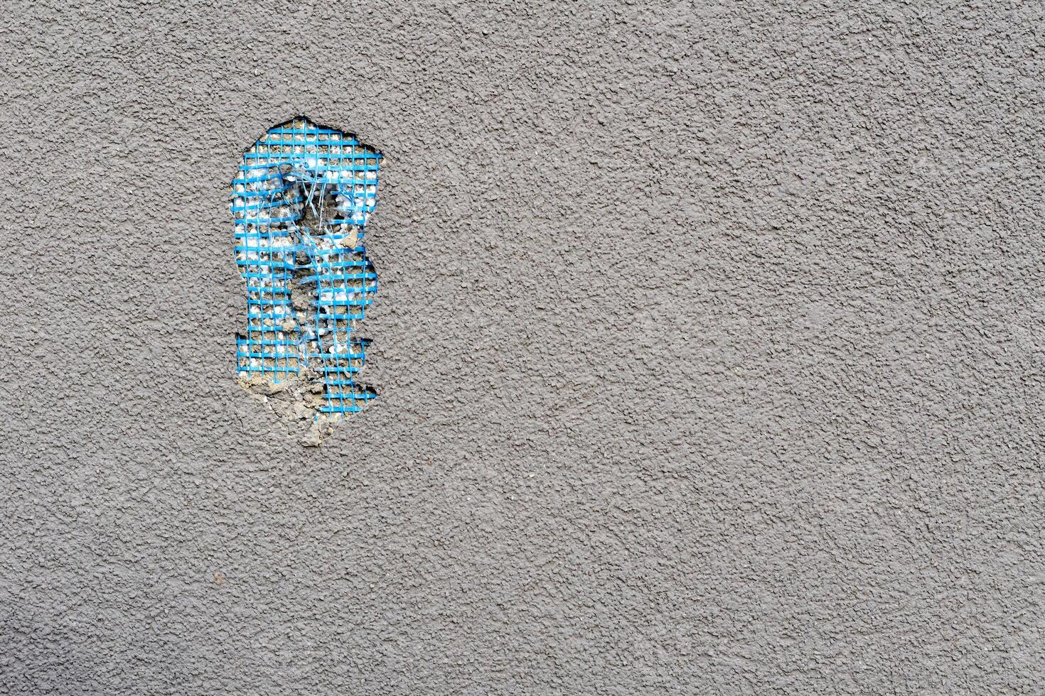 Bad work. Hole in the plastered wall from fallen plaster photo