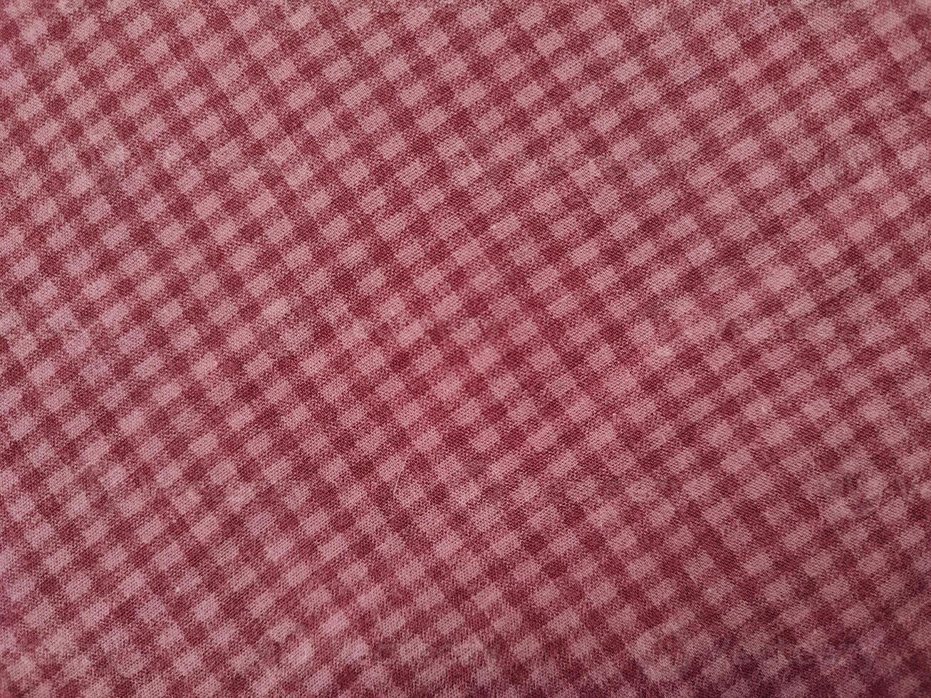 The background and pattern of the fabric is seamless alternating red checkered material photo