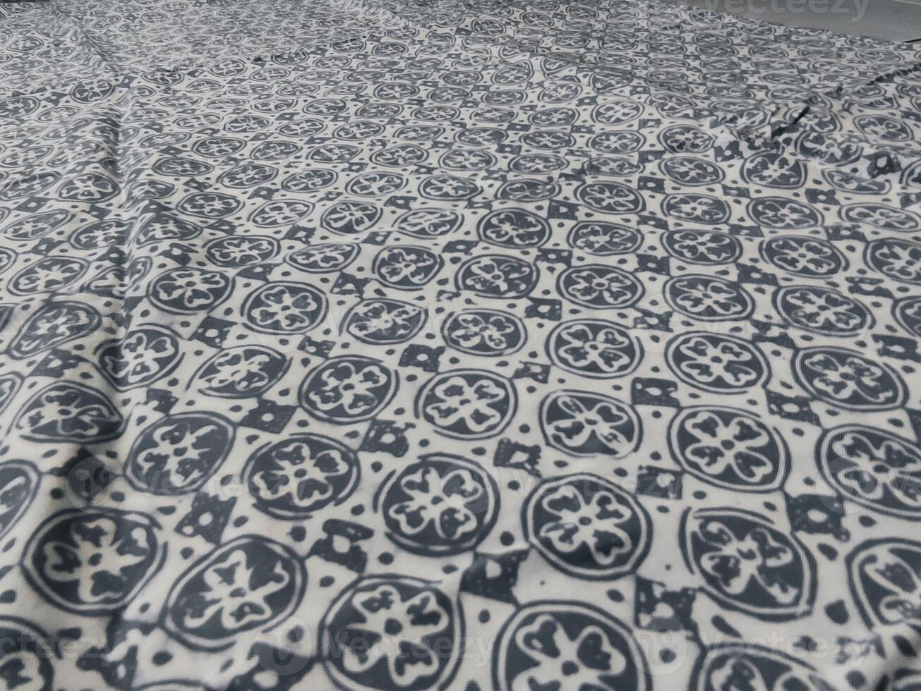 a bed with a blue and white pattern on it photo