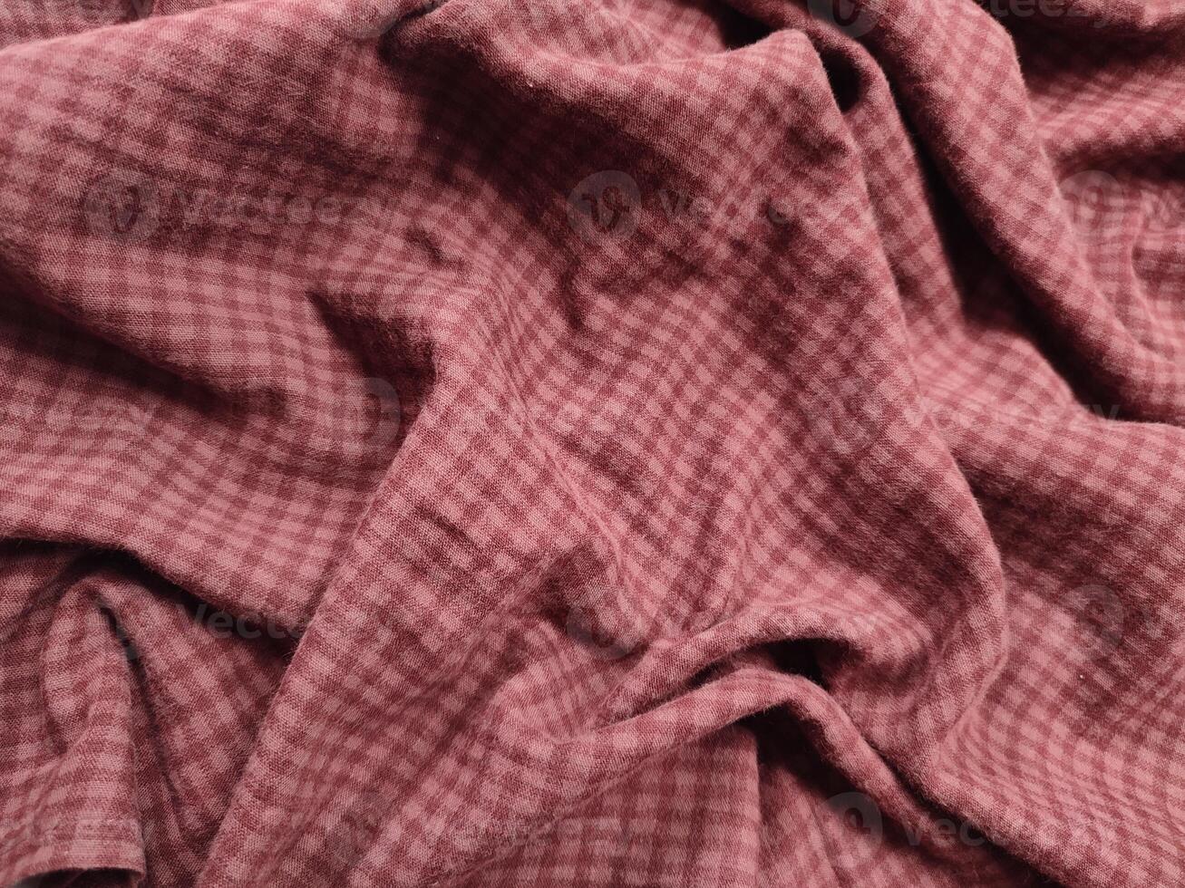 a close up of a pink and white checked fabric photo