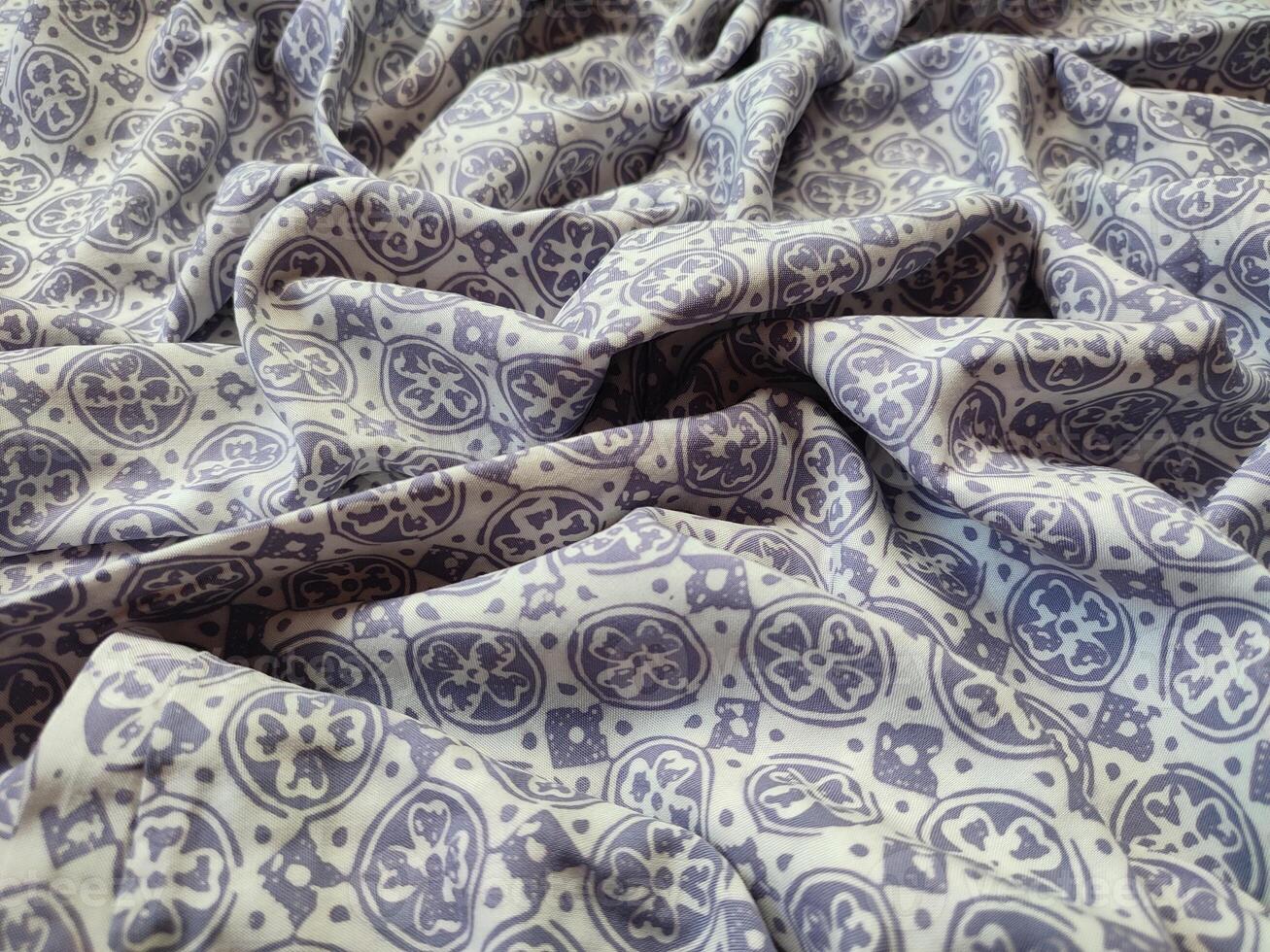 a close up of a purple and white fabric photo