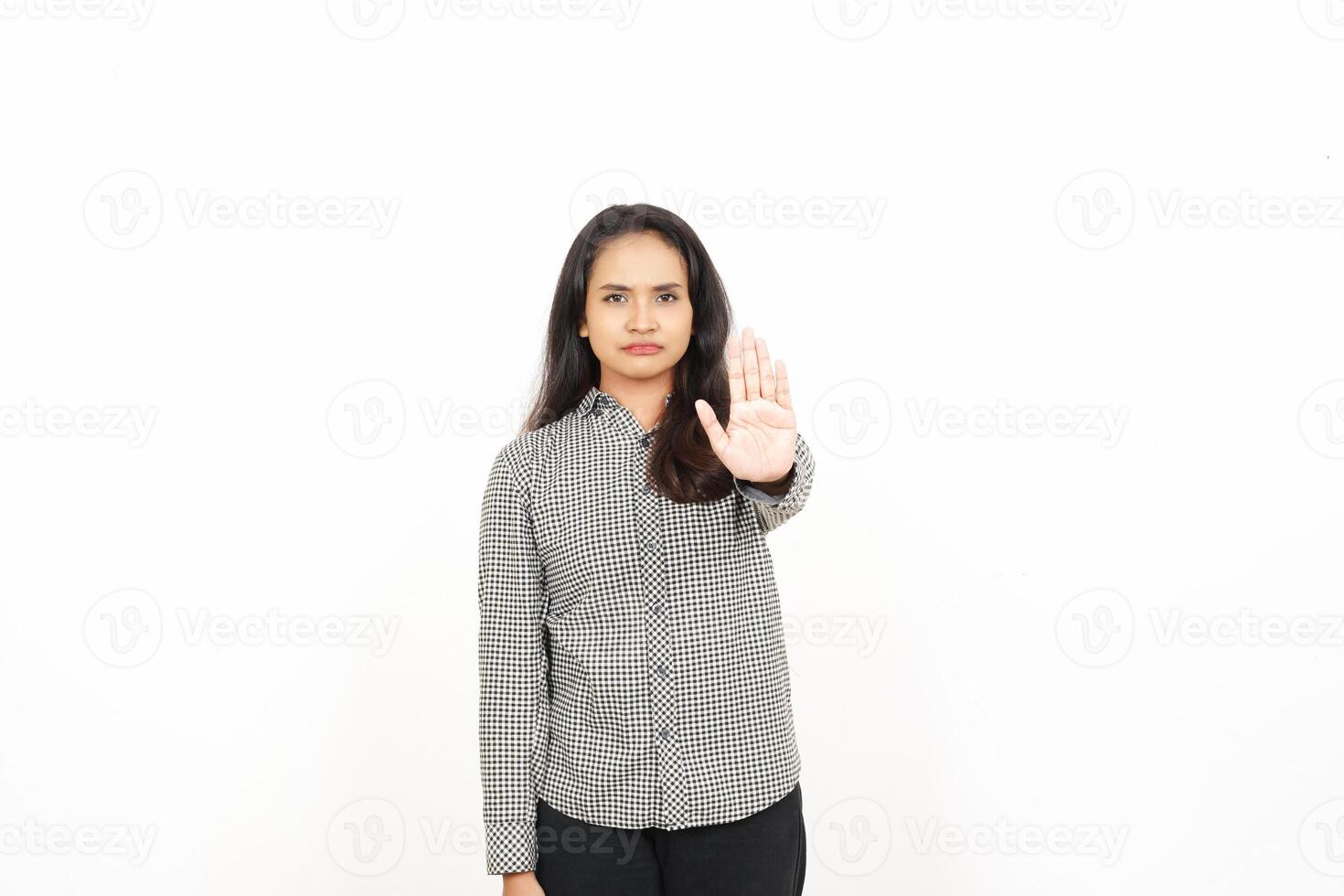 A woman is making a stop sign with her hand photo