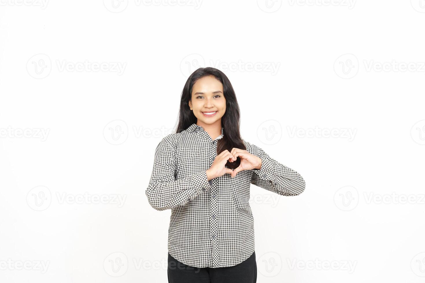 A woman making a heart sign with her hands photo
