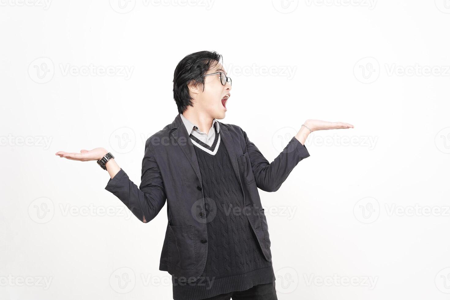 A man in a suit is holding his hands out photo