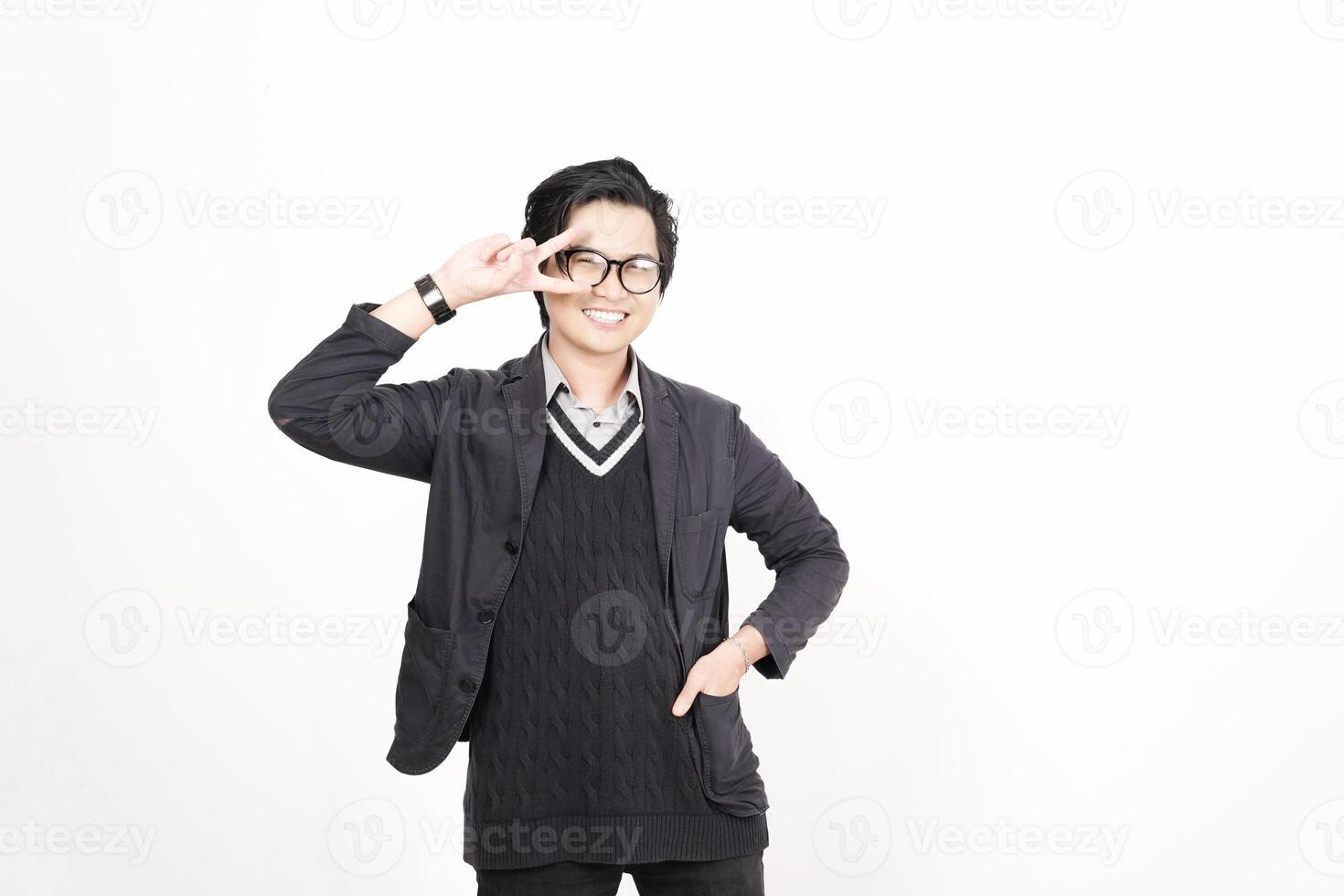 A man in glasses and a sweater posing for the camera photo