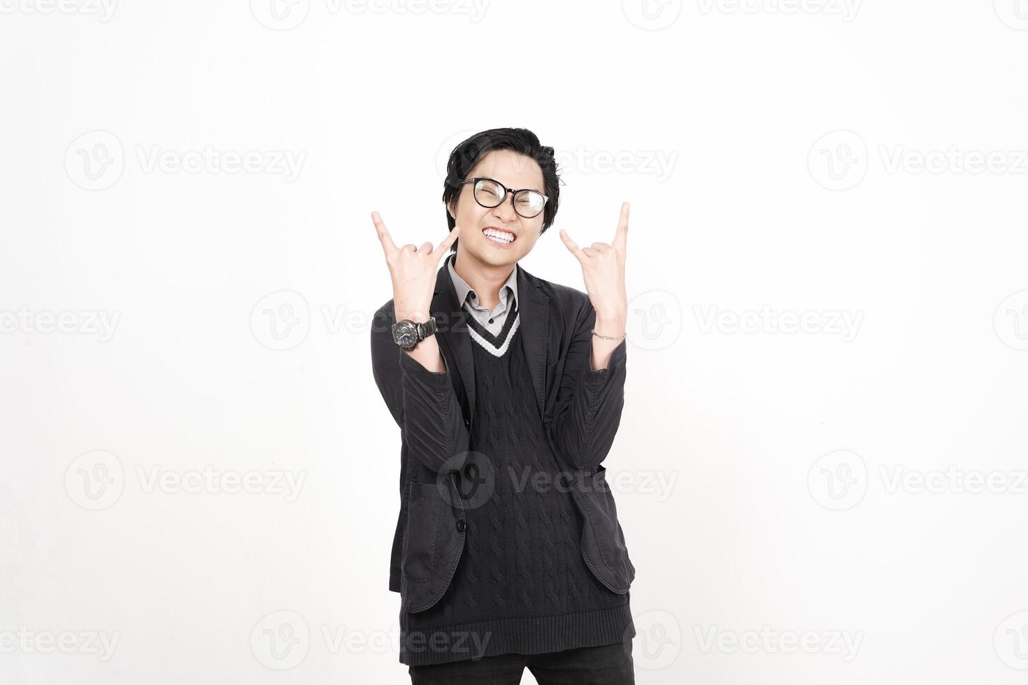 A man in glasses and a sweater is making a peace sign photo