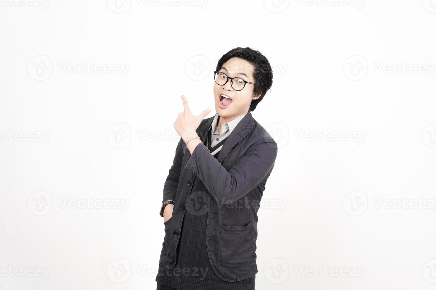 A man in glasses pointing at something photo