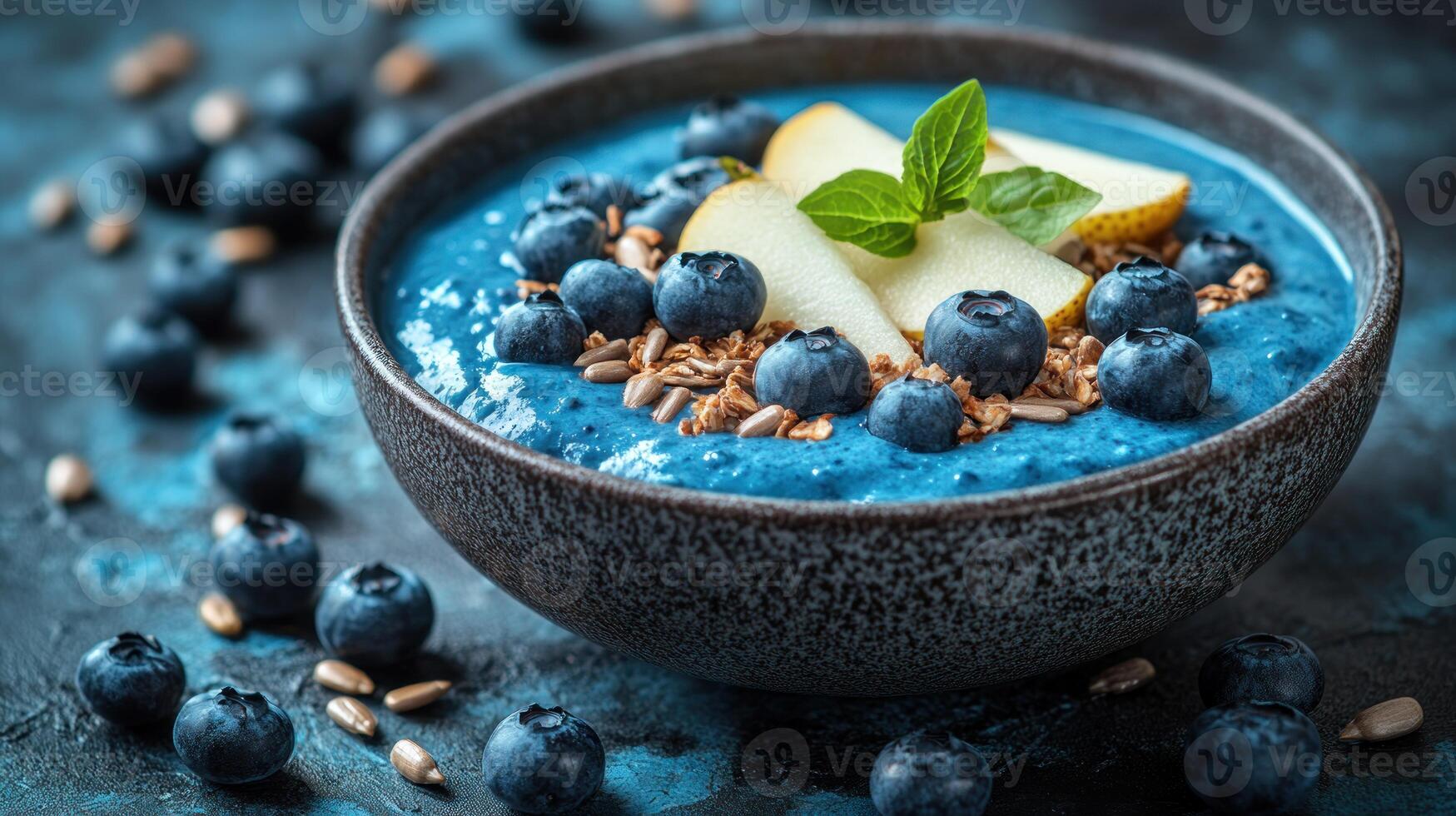 Blueberry smoothie bowl with blueberries and nuts photo