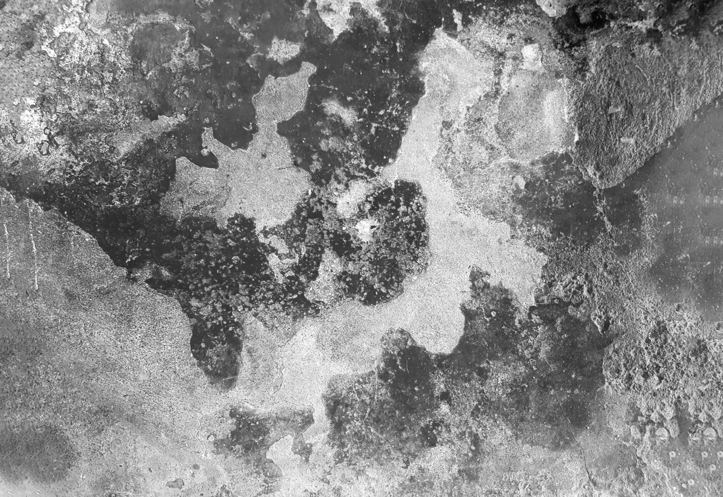 Damaged concrete wall background in black and white tone. Abstract of cement wallpaper in monochrome style. photo