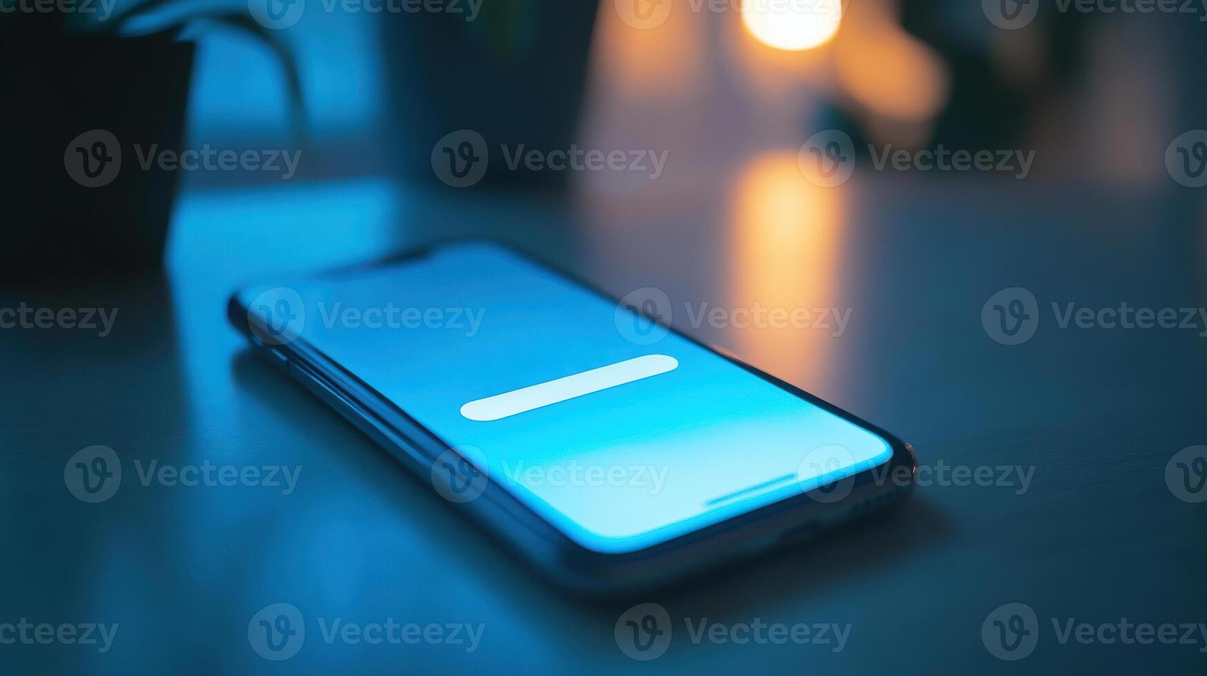 Smartphone on table with glowing screen in evening light. 2fa authentication login photo