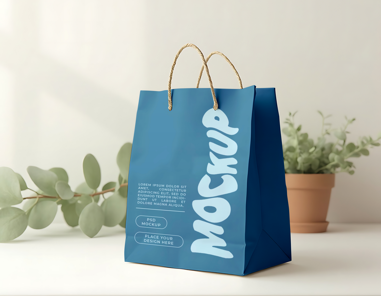 A blue paper shopping bag with the word Mockup displayed prominently psd