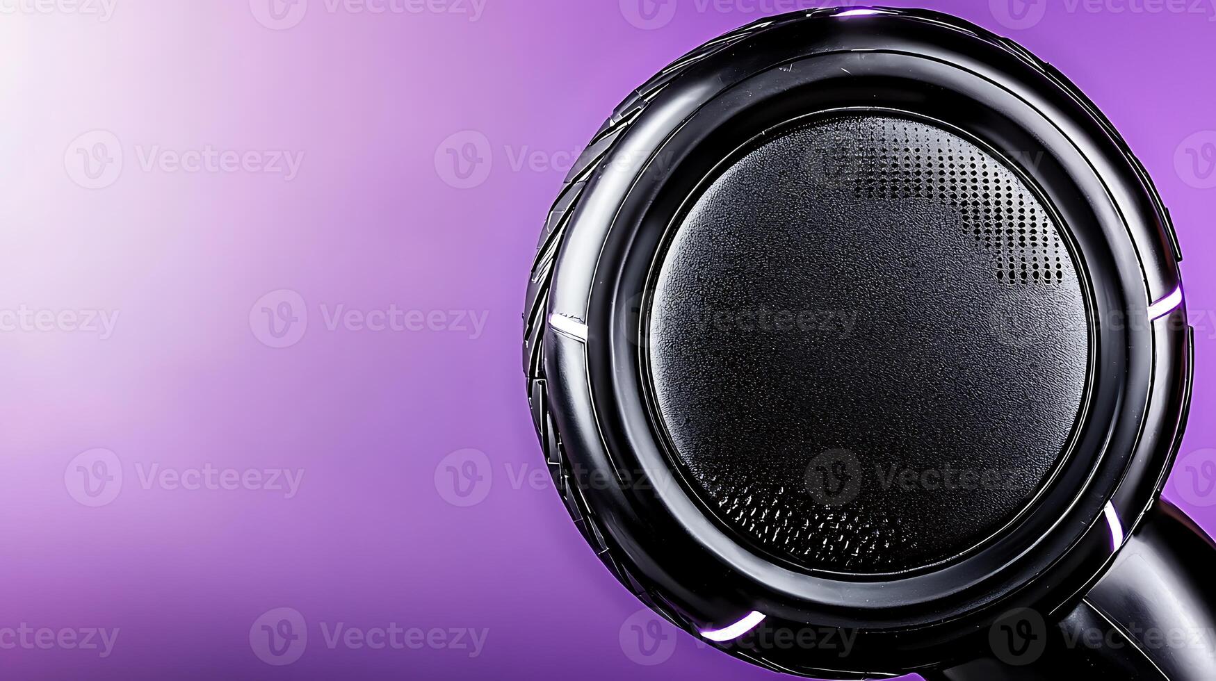 Close-up view of a sleek black headphone against a vibrant purple background, showcasing modern design photo