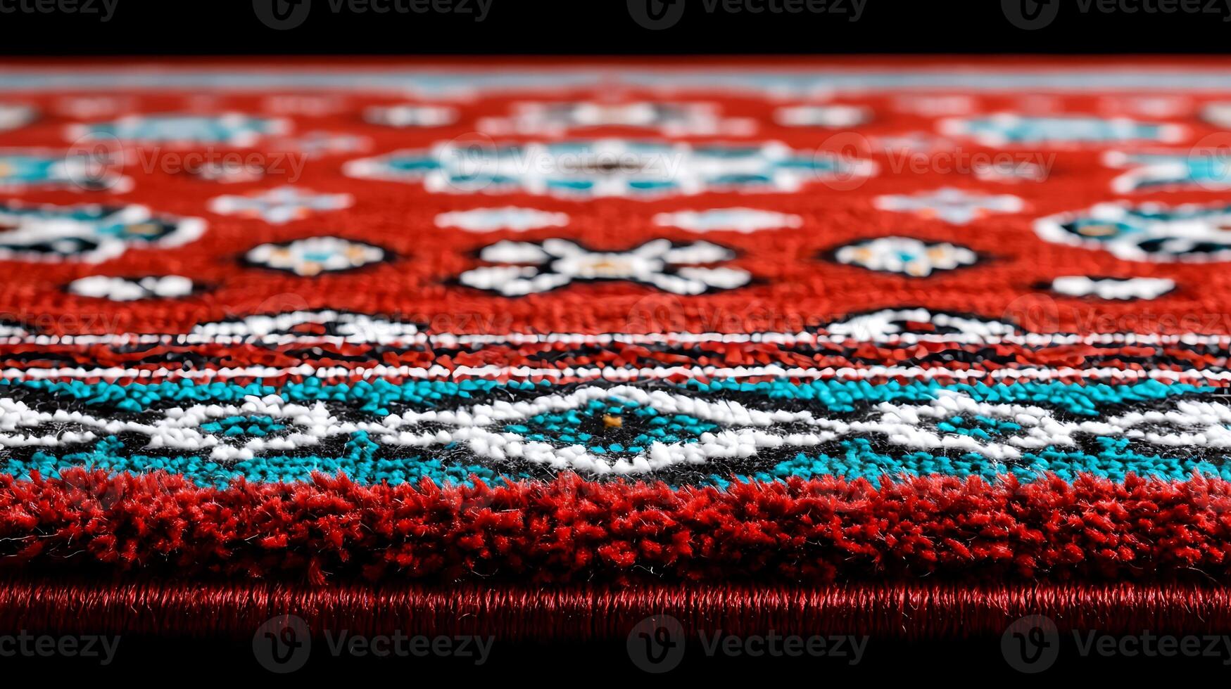 Close-up of a vibrant red patterned rug showcasing intricate designs and textures photo
