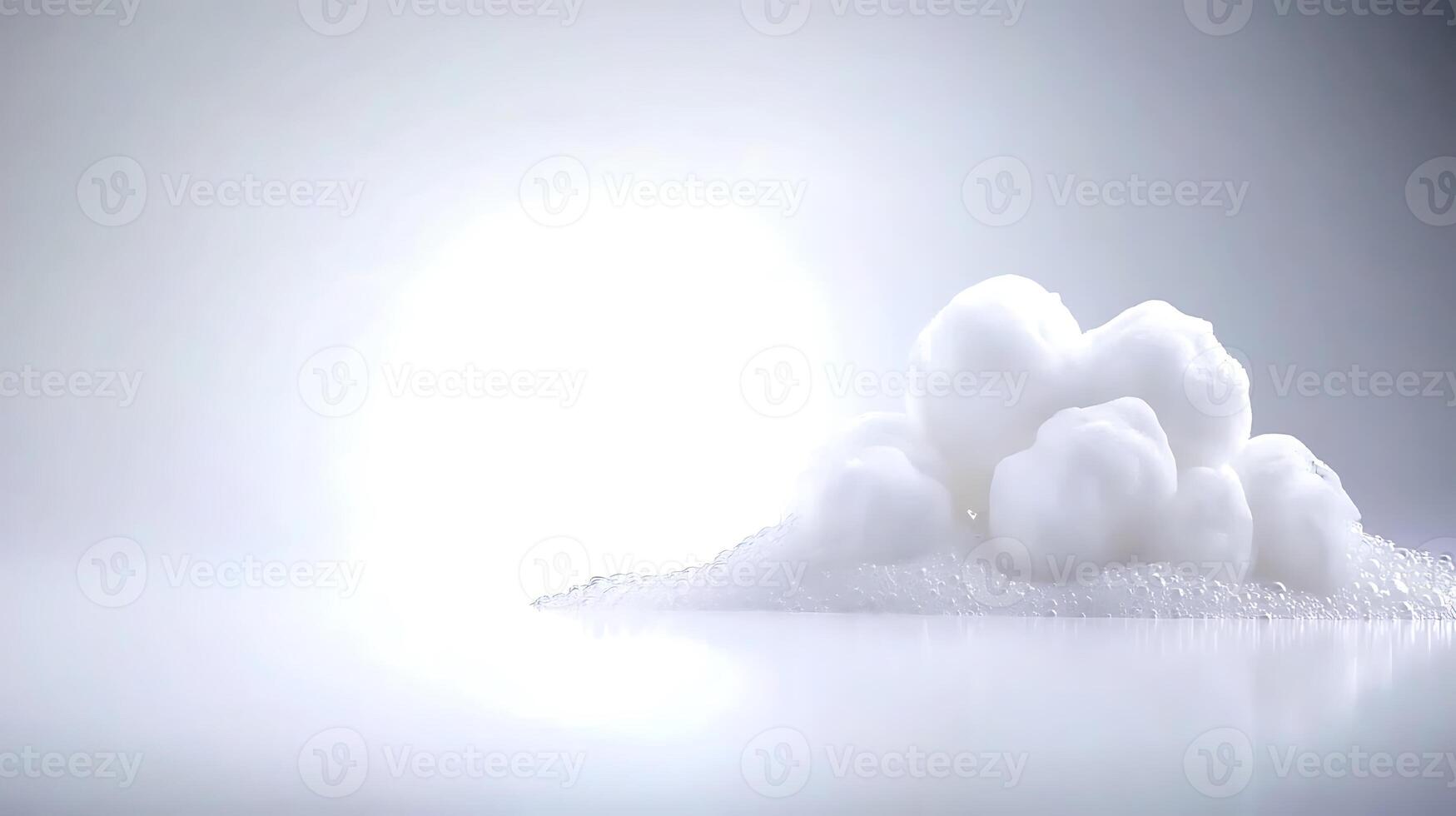 Soft white foam formation on a reflective surface with a bright light background, creating a serene atmosphere photo