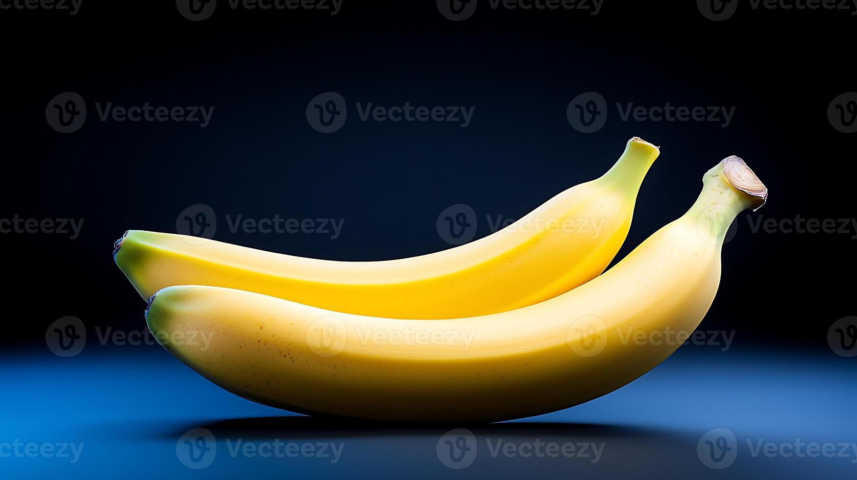 Two ripe bananas resting on a blue surface with a soft gradient background, ideal for food imagery photo