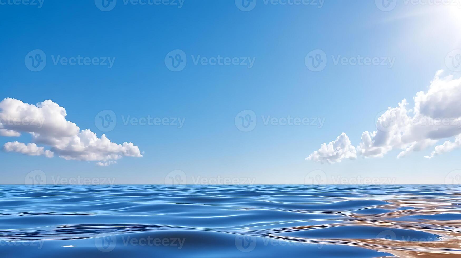 Tranquil ocean waves under a clear blue sky with soft clouds and bright sunlight in the background photo